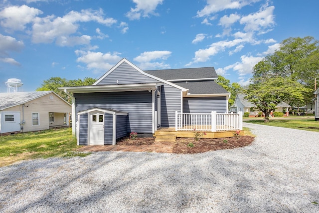 single story home with a wooden deck