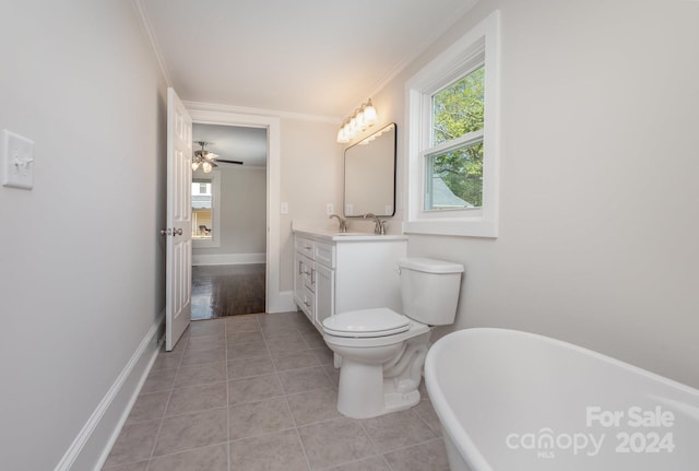 bathroom with ceiling fan, tile floors, toilet, ornamental molding, and vanity