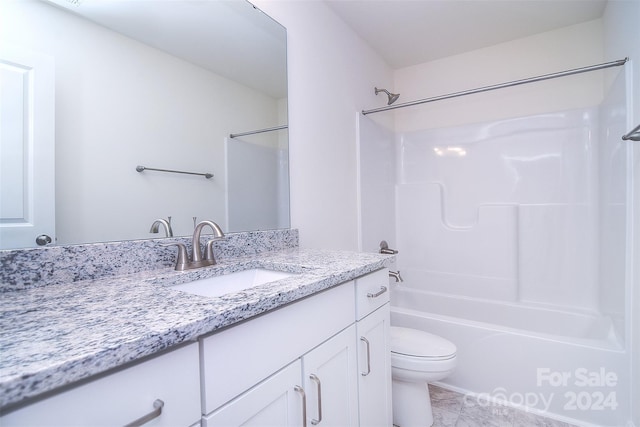 full bathroom featuring vanity,  shower combination, toilet, and tile patterned flooring