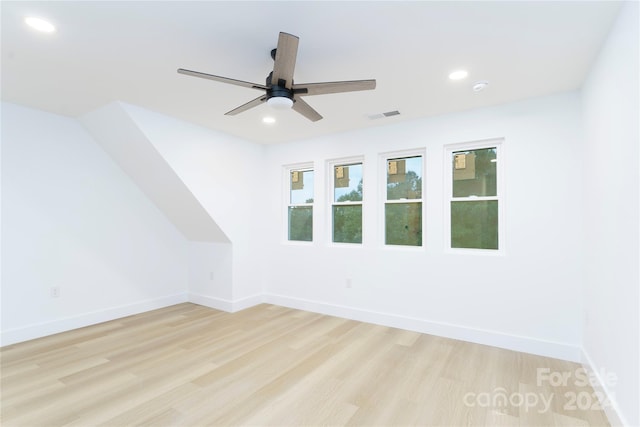 additional living space featuring ceiling fan and light hardwood / wood-style floors