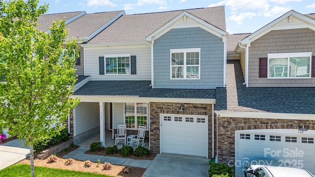 view of front facade featuring a garage and covered porch