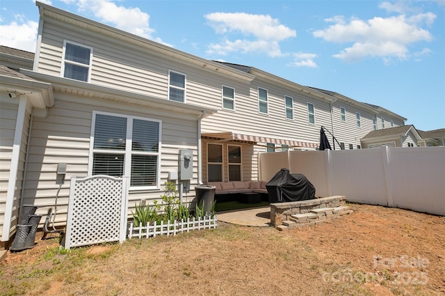 rear view of property with a patio area