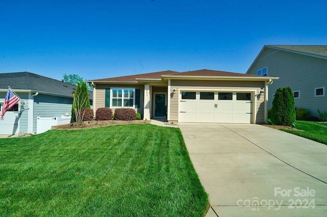 view of front of house with a front lawn and a garage