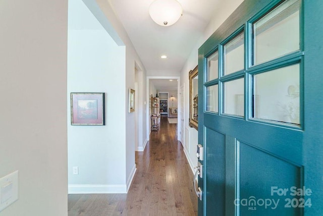 hallway featuring wood-type flooring