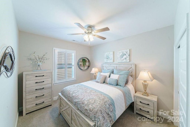 bedroom with light carpet and ceiling fan