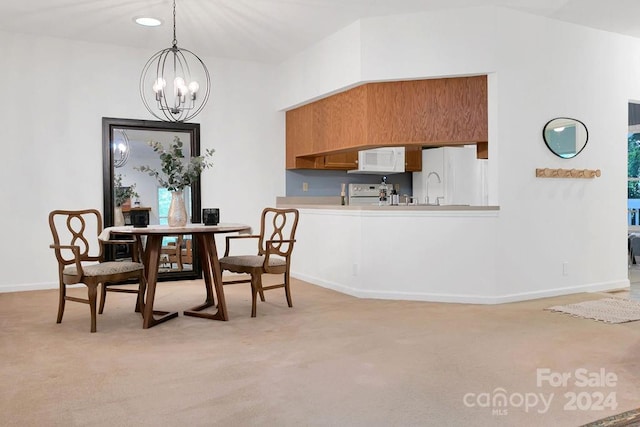 dining room featuring carpet floors, a notable chandelier, and sink