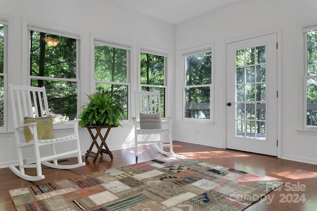 unfurnished sunroom featuring a wealth of natural light