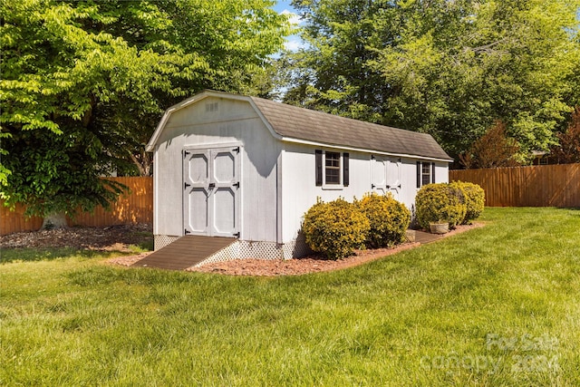 view of outdoor structure with a lawn