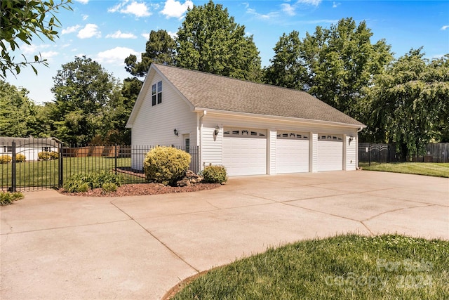 exterior space featuring a yard and a garage