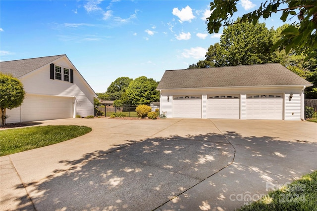 view of side of home featuring a garage