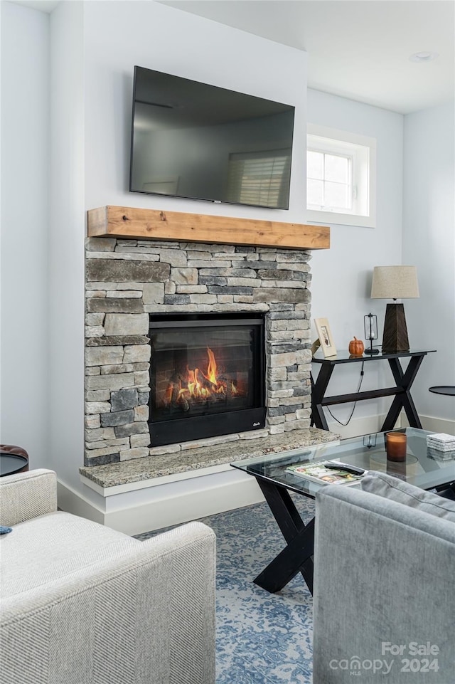 living room featuring a fireplace