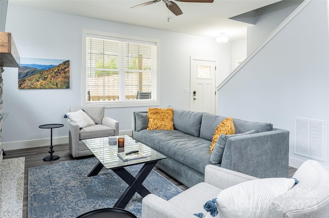 living room with ceiling fan and hardwood / wood-style flooring