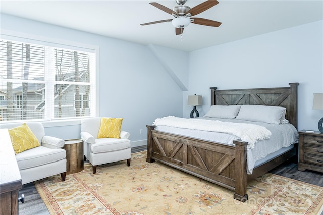 bedroom with wood-type flooring and ceiling fan