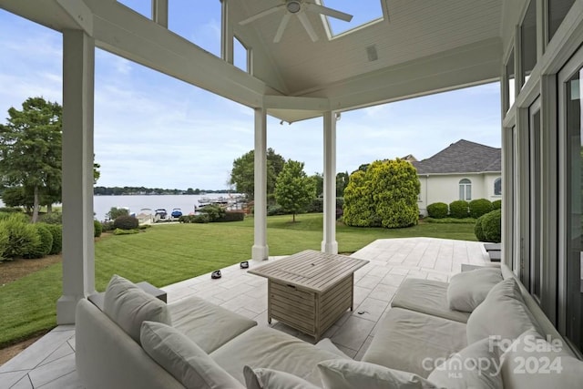 view of patio featuring ceiling fan, a water view, and an outdoor hangout area