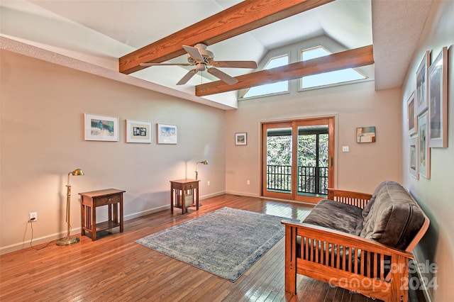 interior space featuring vaulted ceiling with beams, wood-type flooring, and ceiling fan