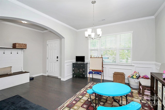 interior space featuring dark wood-type flooring, crown molding, and a chandelier