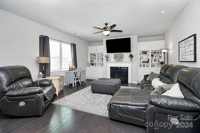 living room featuring dark hardwood / wood-style floors and ceiling fan