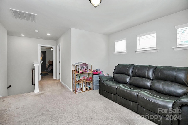 living room featuring light carpet