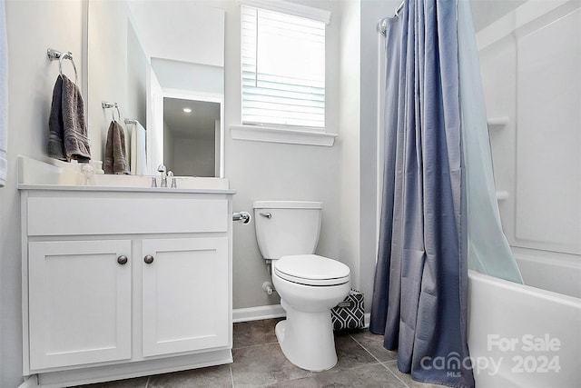 full bathroom featuring toilet, tile flooring, vanity, and shower / tub combo with curtain