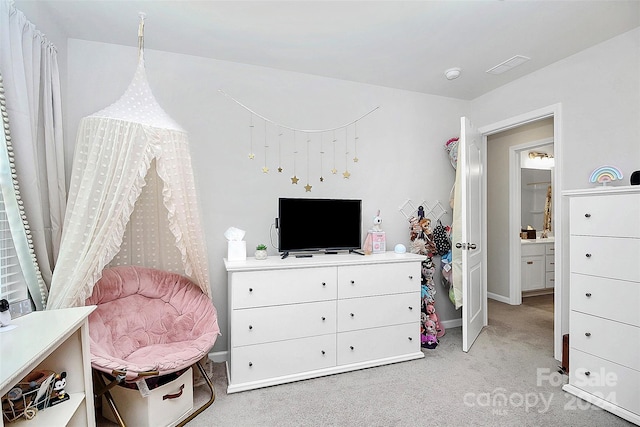 bedroom with light colored carpet