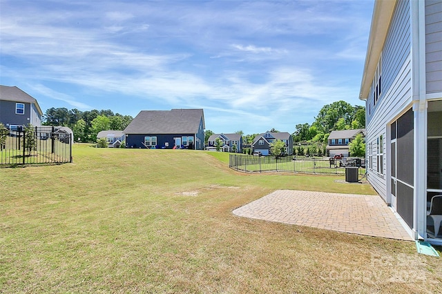 view of yard with a patio and central air condition unit