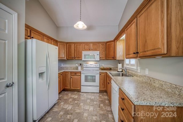 kitchen with pendant lighting, white appliances, light tile floors, sink, and lofted ceiling