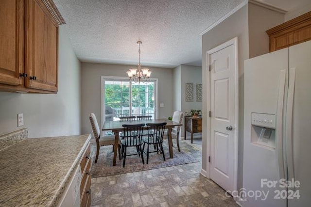 unfurnished dining area featuring a chandelier, a textured ceiling, and light tile flooring