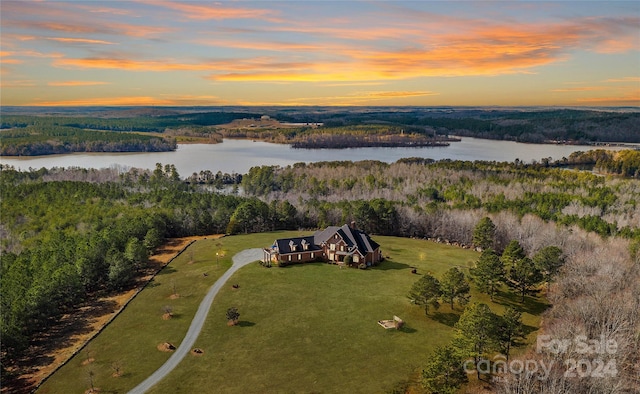 aerial view at dusk with a water view