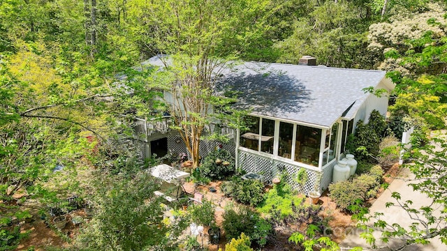 rear view of house with a sunroom