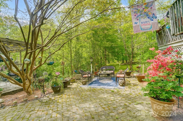 view of yard with a pergola and a patio