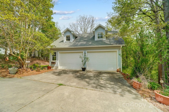 cape cod home with a garage