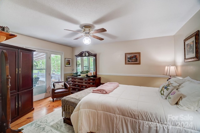 bedroom featuring light hardwood / wood-style floors and ceiling fan