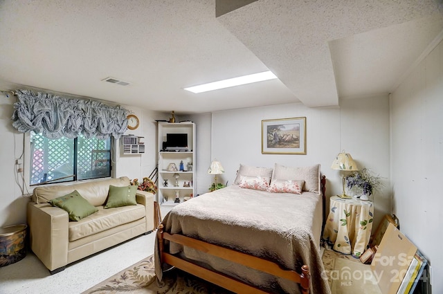 bedroom with a textured ceiling and carpet flooring