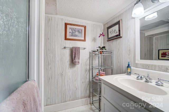 bathroom with vanity and a textured ceiling