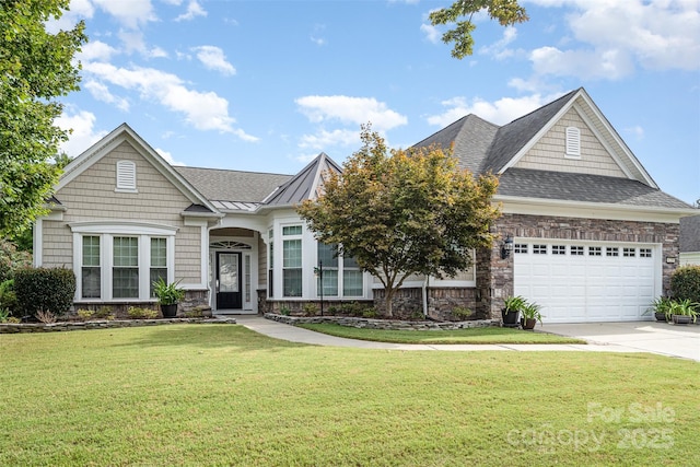 view of front of home with a garage and a front lawn