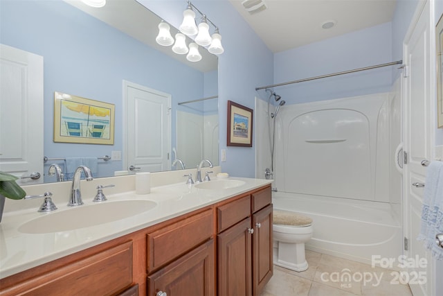 full bathroom with shower / bath combination, vanity, tile patterned floors, and toilet