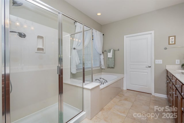 bathroom featuring vanity, separate shower and tub, and tile patterned floors