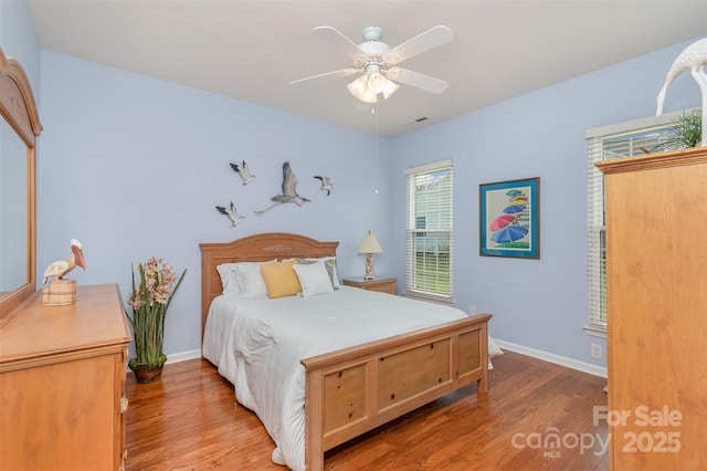 bedroom with hardwood / wood-style floors and ceiling fan