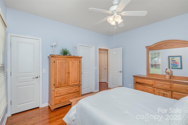 bedroom featuring light hardwood / wood-style floors and ceiling fan