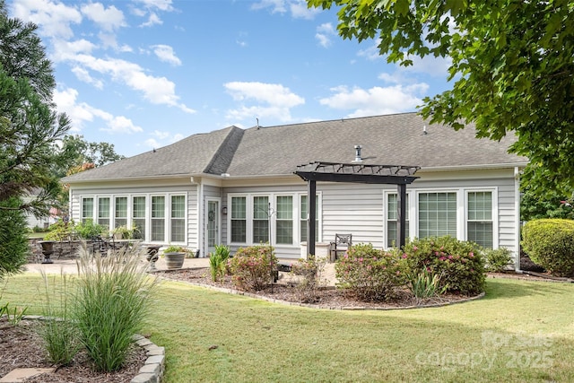 back of property with a yard, a pergola, and a patio