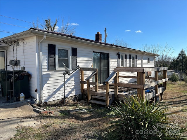 view of front of property with a wooden deck