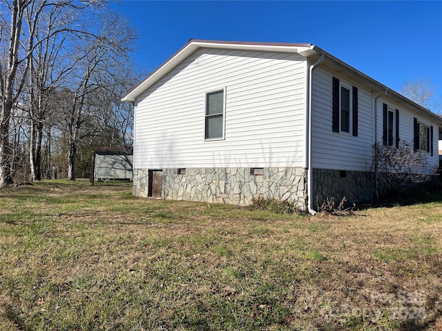 view of property exterior featuring a yard