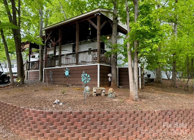 view of side of home with a porch