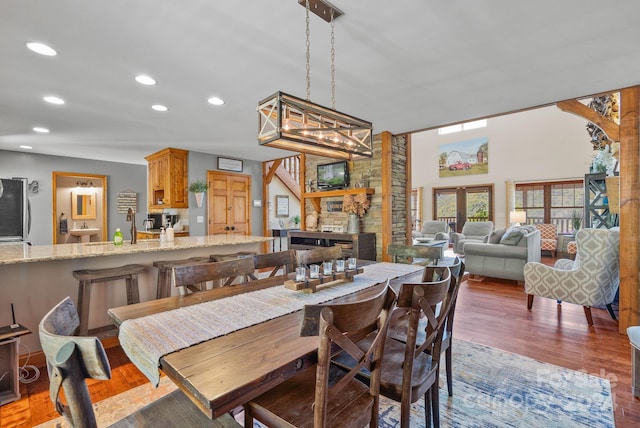 dining space with dark hardwood / wood-style flooring