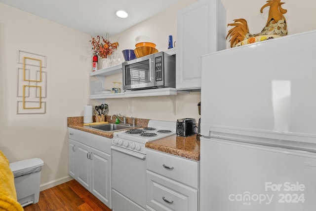 kitchen featuring white cabinets, white appliances, sink, and dark wood-type flooring