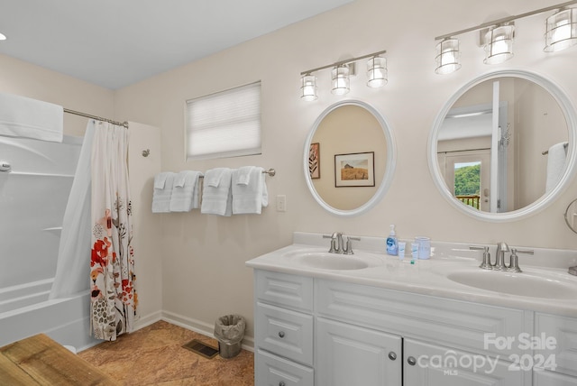 bathroom with shower / bath combination with curtain, dual vanity, and tile flooring