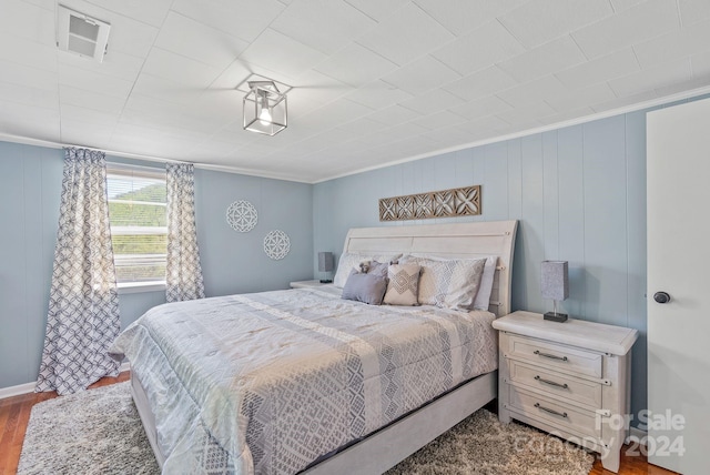 bedroom featuring dark hardwood / wood-style floors