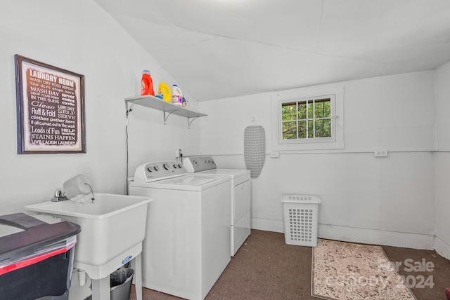 clothes washing area with sink, washer and dryer, and dark carpet