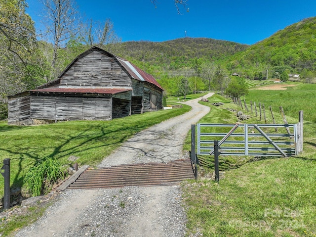 exterior space with a rural view and an outdoor structure