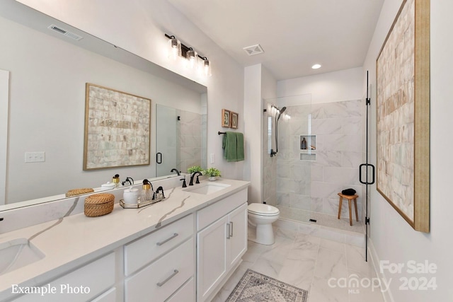 bathroom with a shower with shower door, toilet, double vanity, and tile flooring